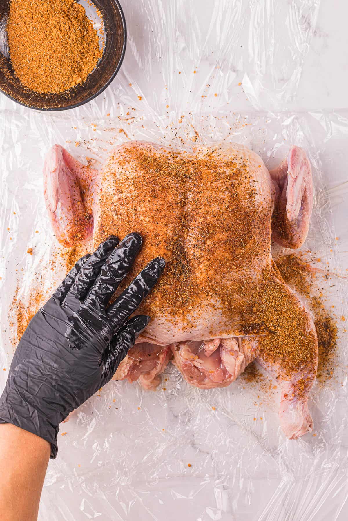 coating chicken with dry rub