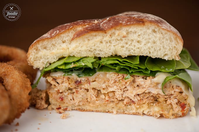 A close up of a turkey burger cut in half