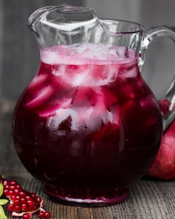 Pomegranate Vodka Punch is an easy sparkling party cocktail. Made with chilled pomegranate juice, fresh pomegranate arils, Prosecco, and sweetened with simple syrup and ginger ale, this party punch takes only minutes to make and serves a crowd.