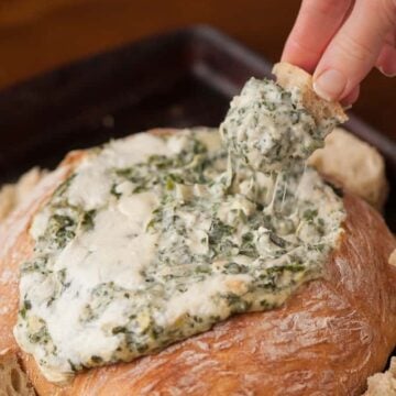 Unlike warm cheesy dips made with cream cheese or mayonnaise, this Spinach Artichoke Fondue Dip is made with Gruyere, Parmesan, and mozzarella.
