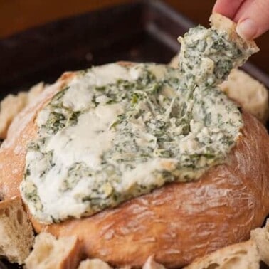 Unlike warm cheesy dips made with cream cheese or mayonnaise, this Spinach Artichoke Fondue Dip is made with Gruyere, Parmesan, and mozzarella.