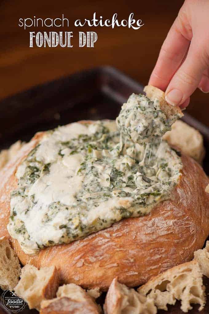 warm spinach artichoke dip in a bread bowl