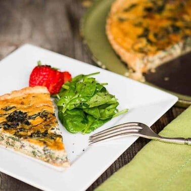 Mushroom Spinach Quiche is a rich and savory meal baked in an all butter pie crust. This homemade quiche recipe is perfect as breakfast or lunch when served with lightly dressed greens.