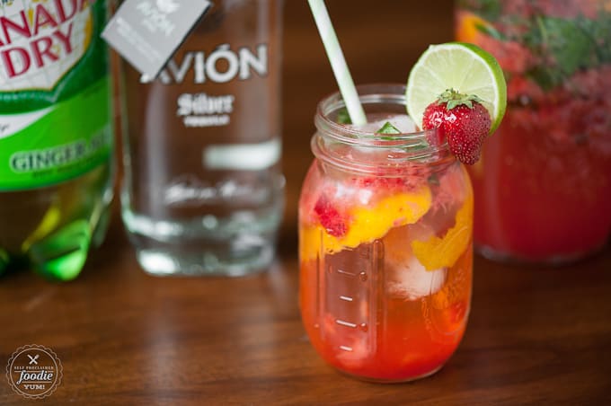 mason jar of strawberry basil tequila cocktail