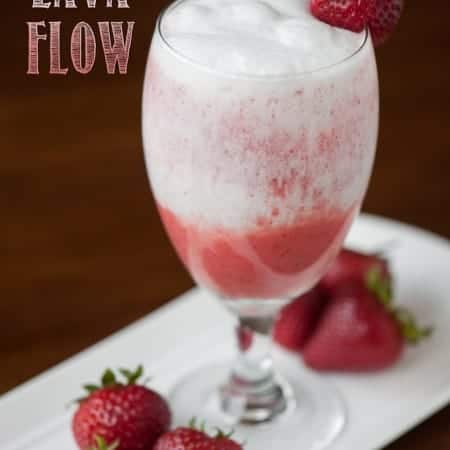 This blended non-alcoholic Strawberry Coconut Lava Flow made with fresh strawberries, pineapple juice and coconut cream is the perfect tropical mocktail.
