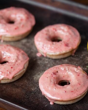 These easy to make Baked Strawberry Lemonade Donuts made from freeze dried strawberries and fresh Meyer lemons are the perfect summer breakfast treat!