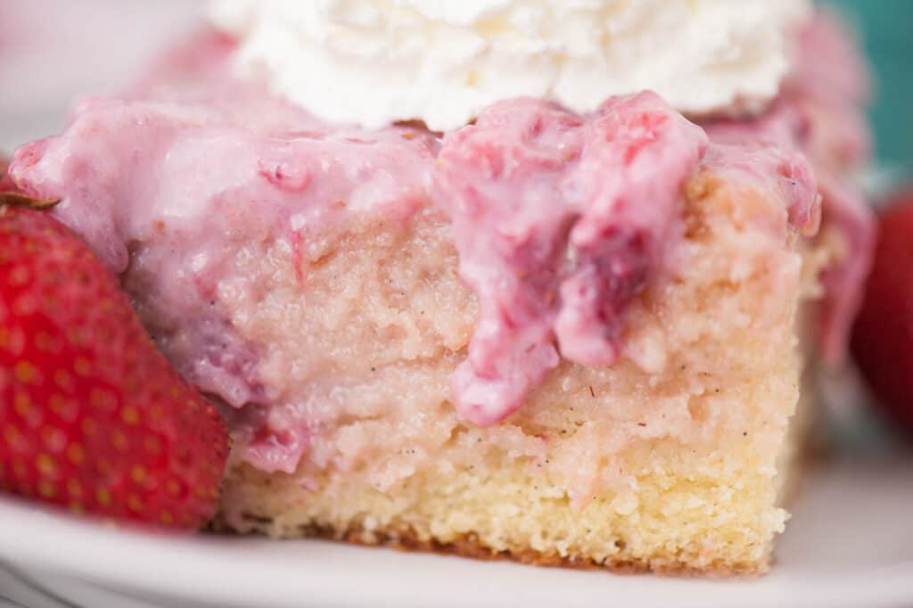 close up of vanilla cake with strawberry topping