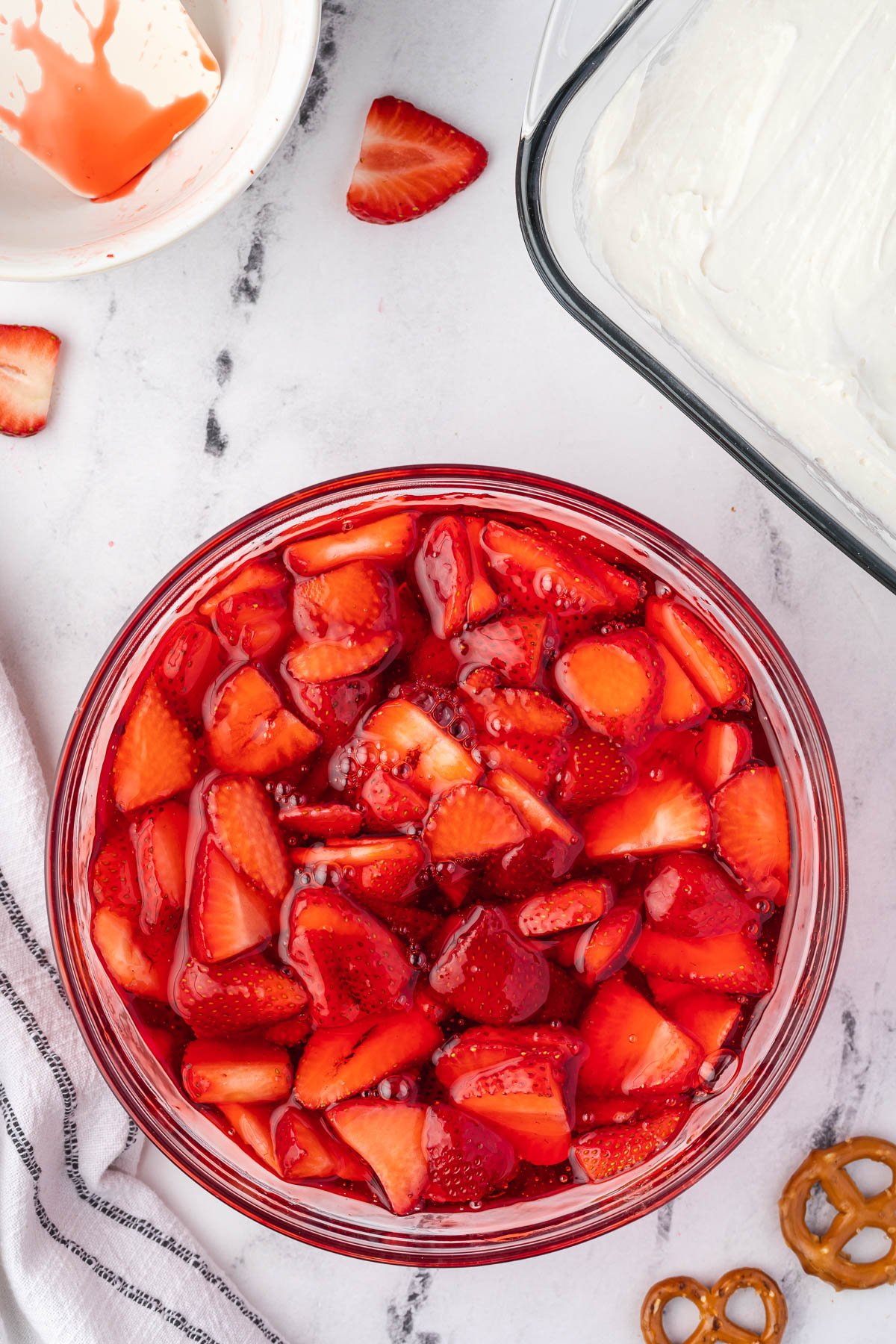 sliced strawberries in strawberry jello.