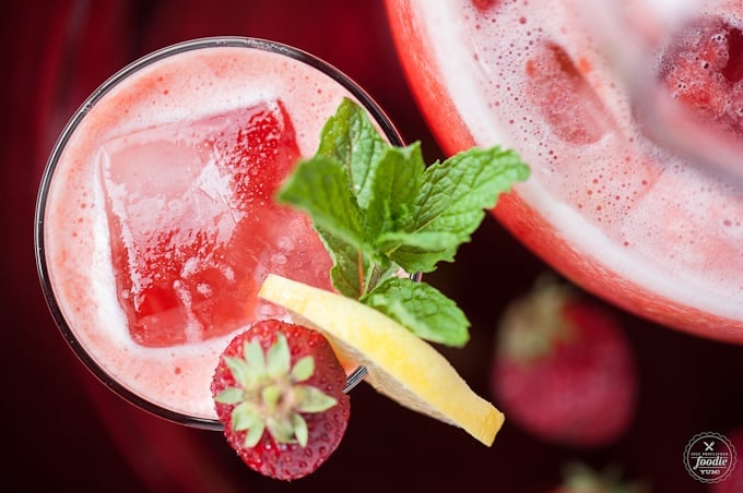 Strawberry Rhubarb Lemonade with strawberry, lemon and mint garnish