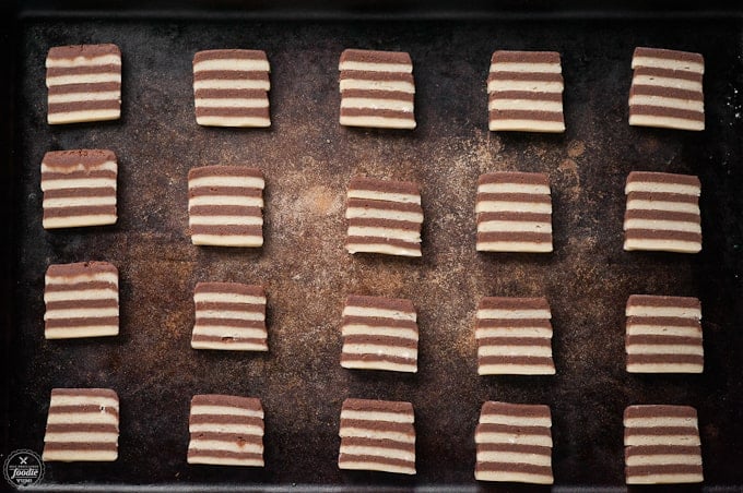 a row of pre-baked striped chocolate cookies