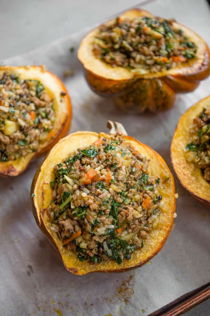 sausage and rice Stuffed Acorn Squash before they get baked in oven