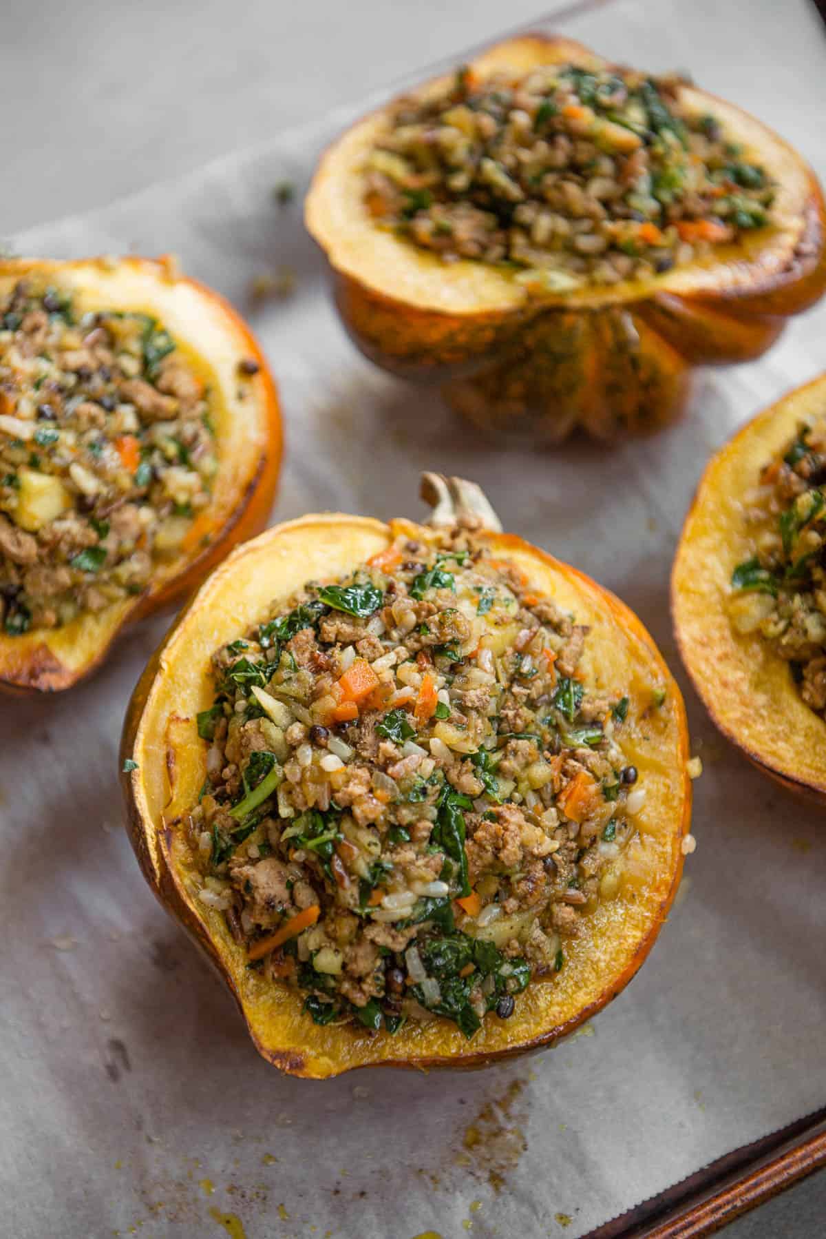 sausage and rice Stuffed Acorn Squash before they get baked in oven