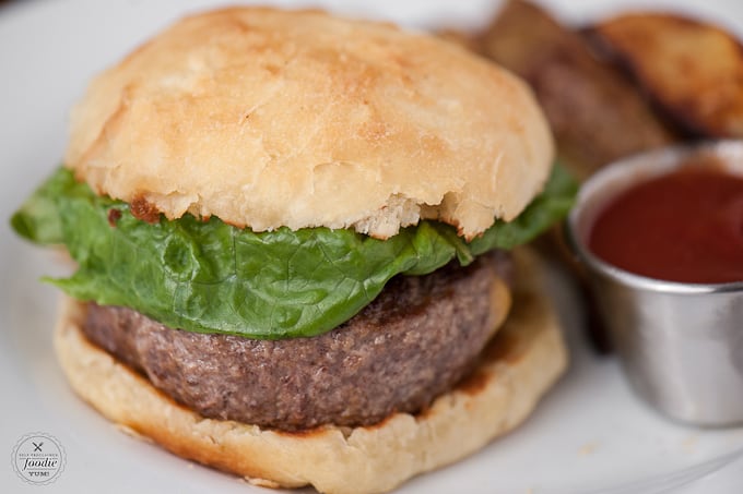 a burger with fries and ketchup