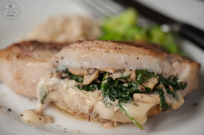 A close up of Pork chop stuffed with spinach, mushroom and cheese