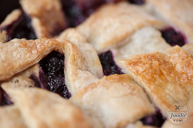 A close up of the top of a berry pie