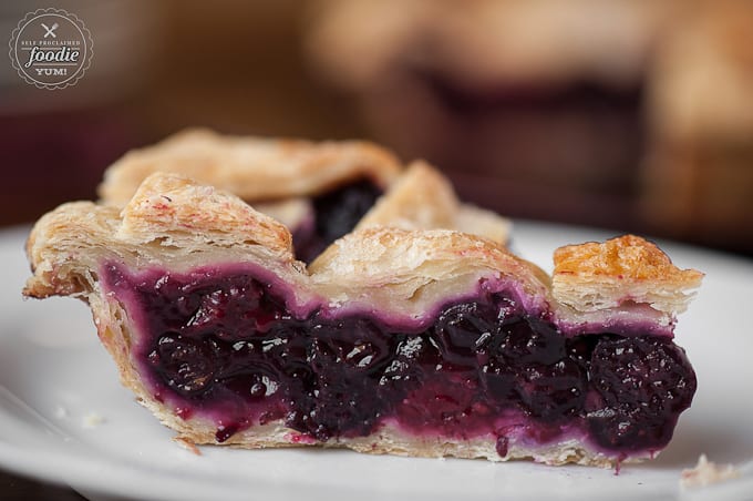 A close up of a piece of summer berry pie