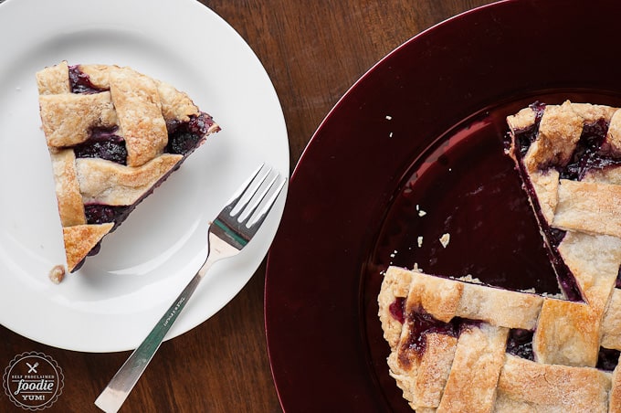 A slice of berry pie on a plate