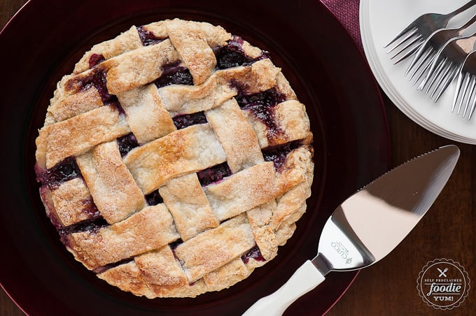 looking down at a whole berry pie with a lattice crust