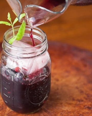 Sweet Berry Sangria is a refreshing cocktail made with summer berries soaked in red wine with berry infused vodka and a sweet bubbly ginger ale.