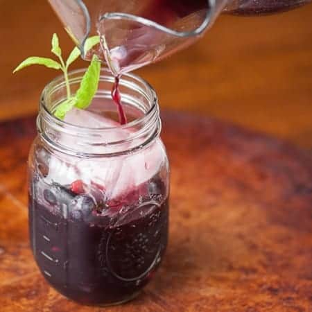 Sweet Berry Sangria is a refreshing cocktail made with summer berries soaked in red wine with berry infused vodka and a sweet bubbly ginger ale.
