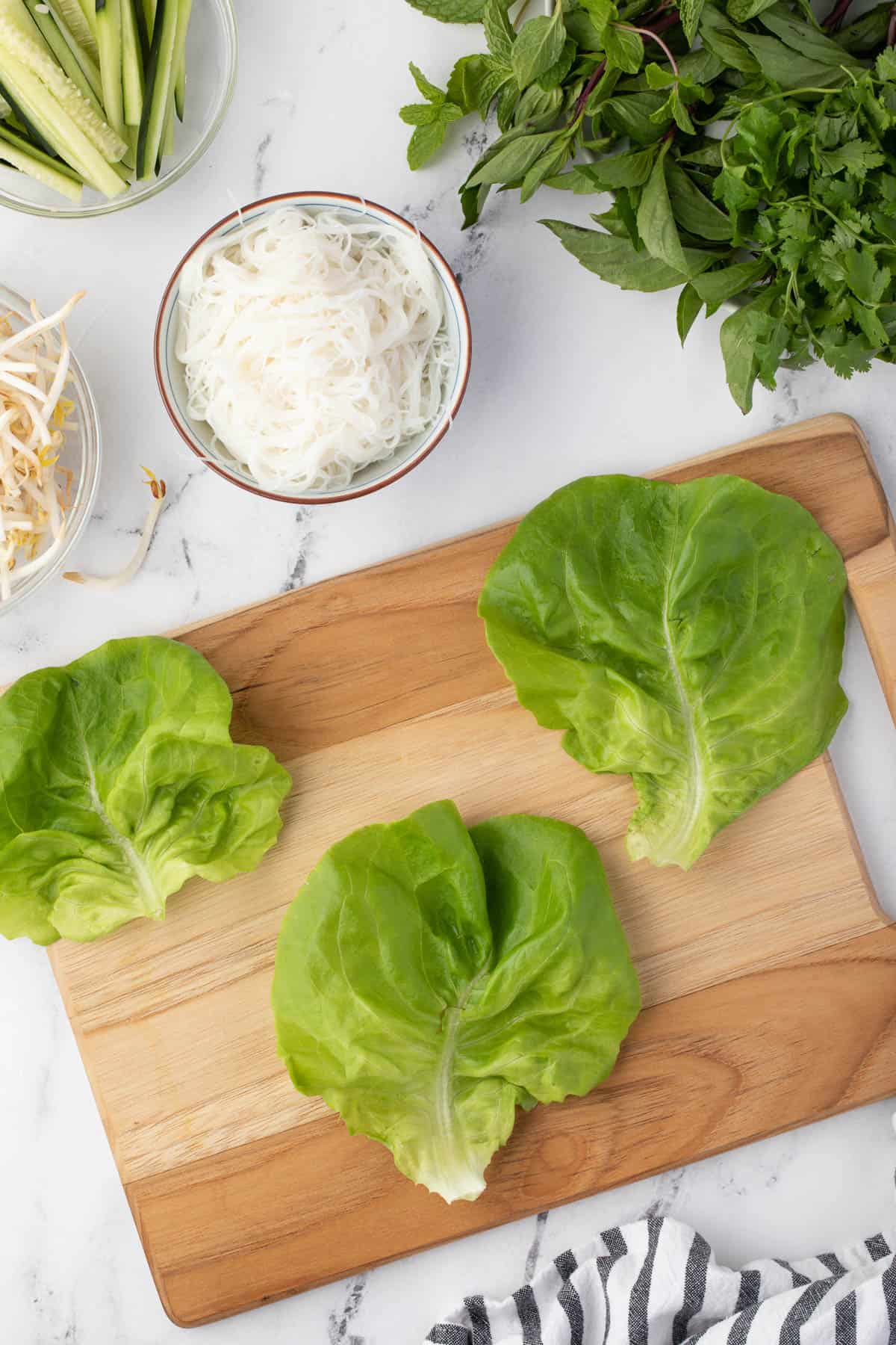 butter lettuce laid out on cutting board.