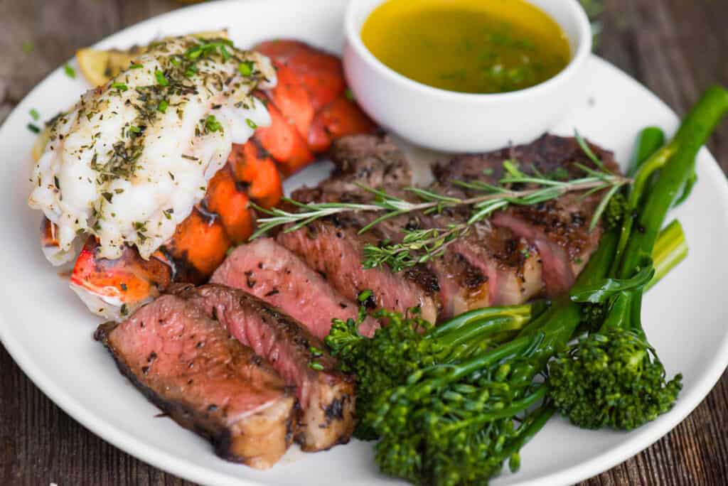 sliced steak and broiled lobster tail