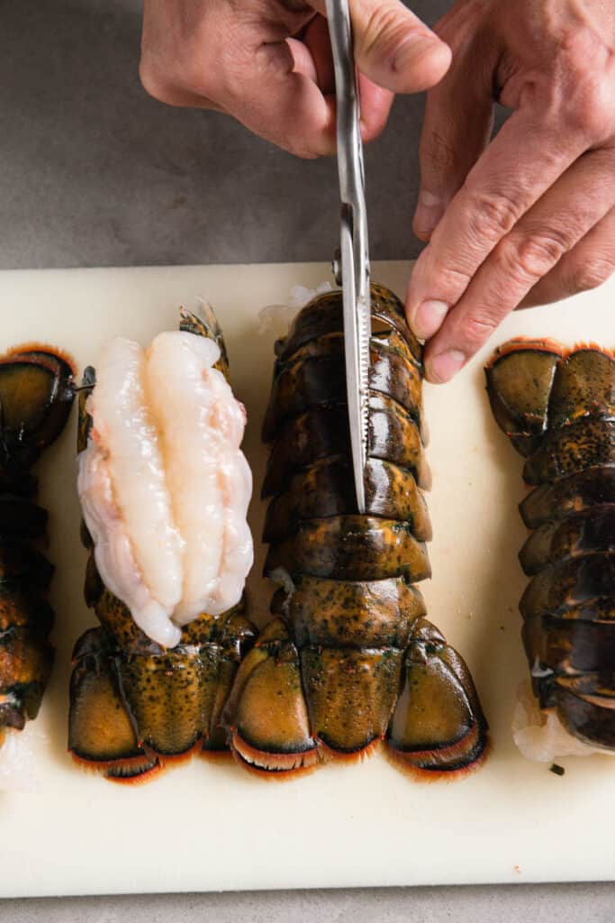 cutting lobster tail with scissors