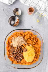 mashed sweet potatoes with crushed pineapple, pecans, and brown sugar.