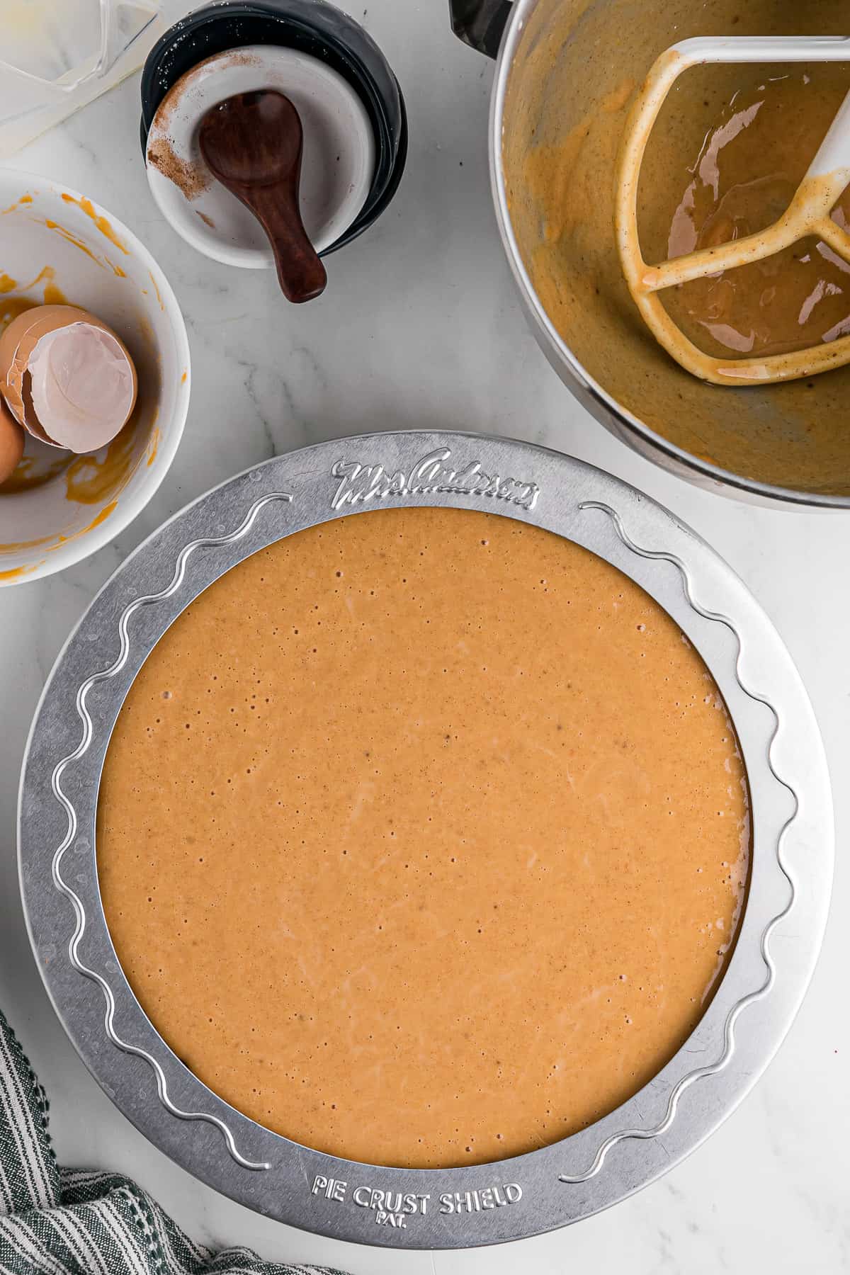 adding a pie shield to sweet potato pie to keep crust from burning.
