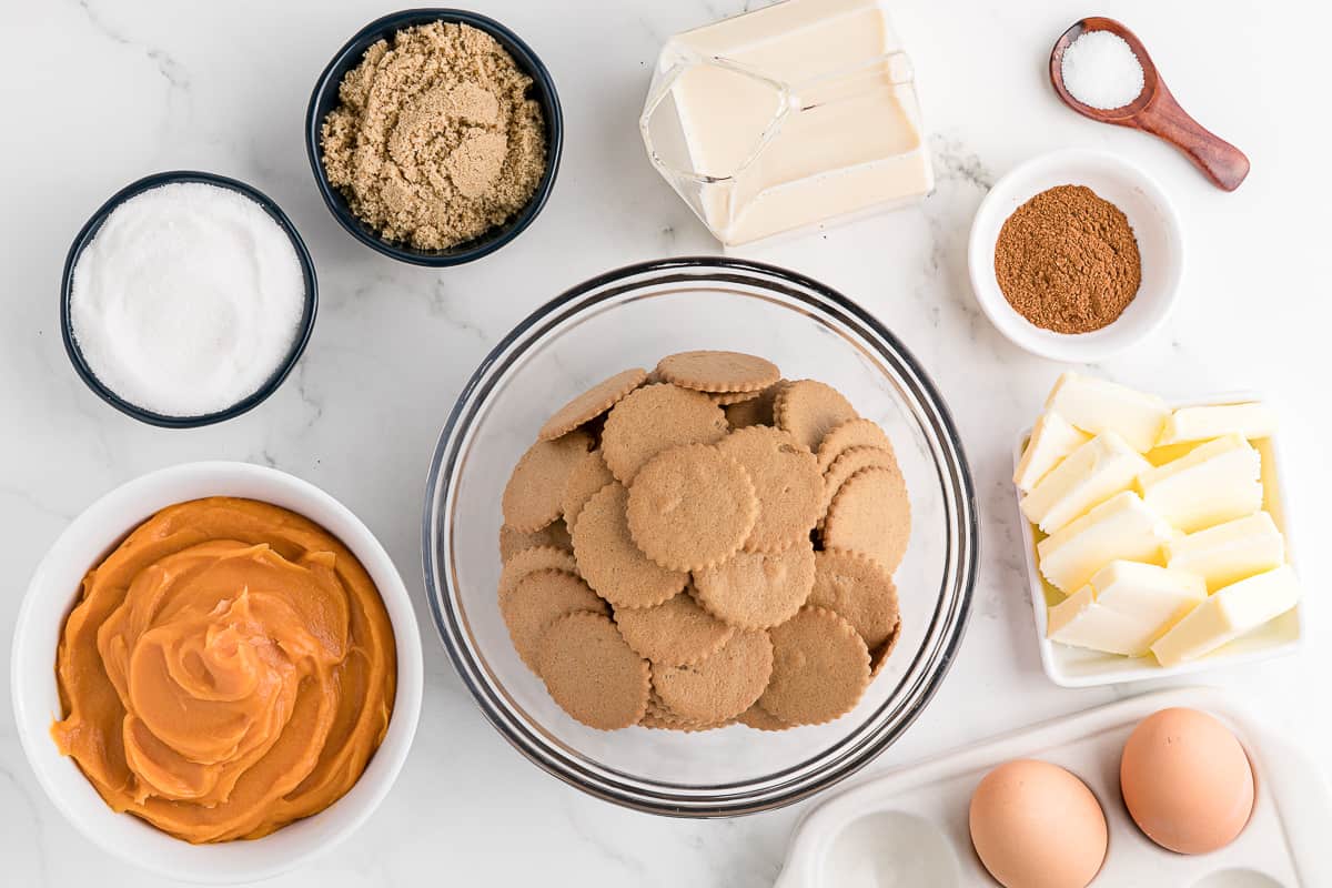 Ingredients needed to make homemade sweet potato pie with a gingersnap crust.