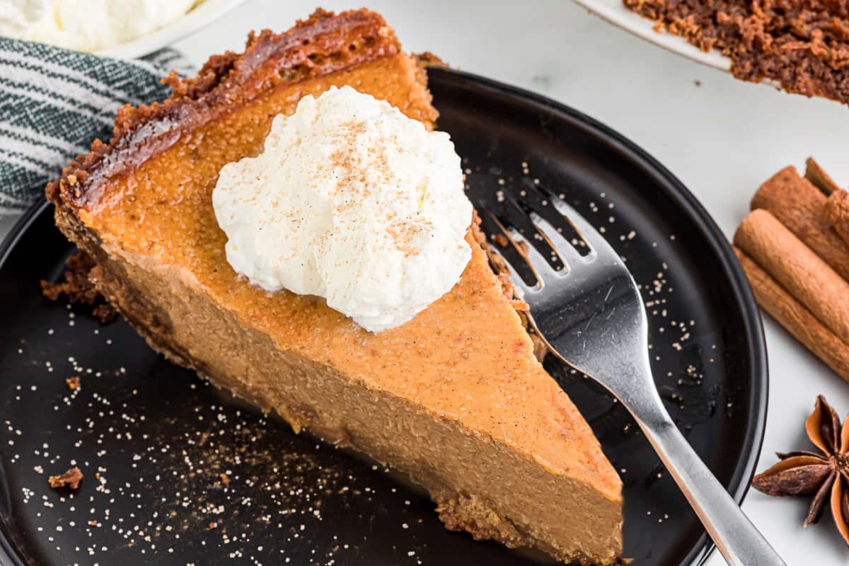 slice of homemade sweet potato pie with a gingersnap crust.