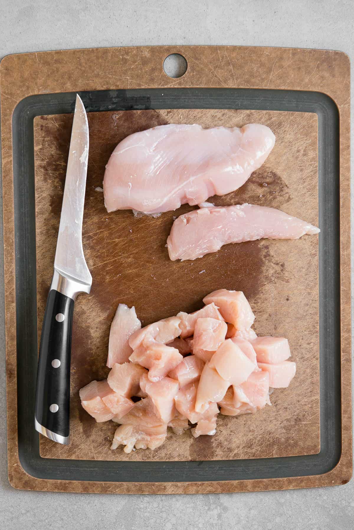 cutting chicken breasts into bite sized pieces