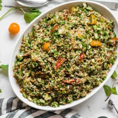 Tabouli mixed with fresh vegetables and herbs to make salad