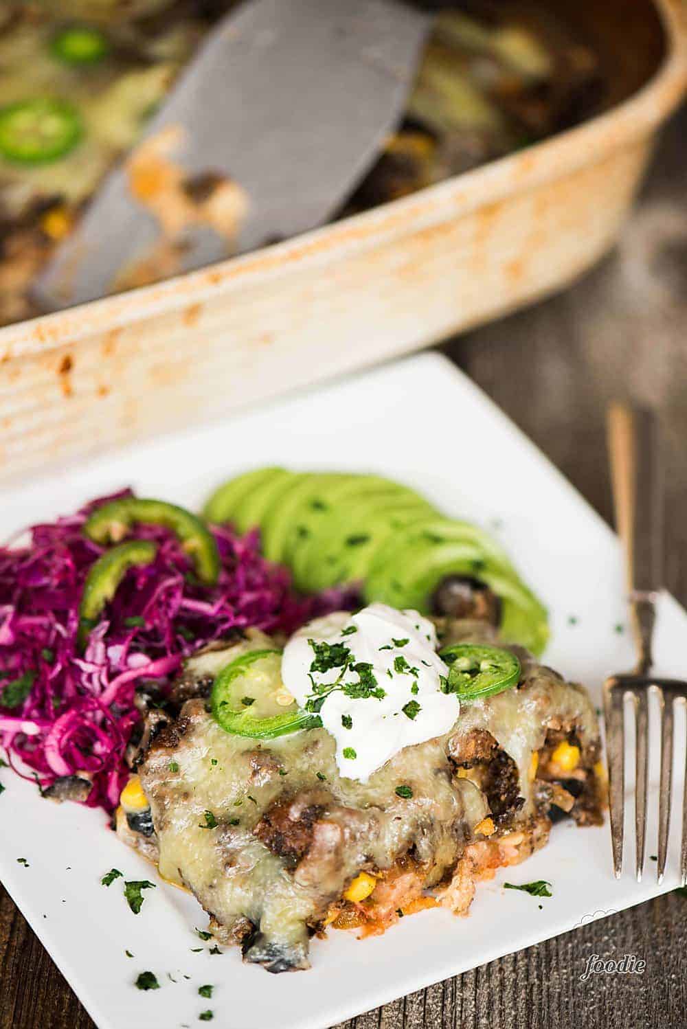 a plate with easy taco casserole, with coleslaw on the side