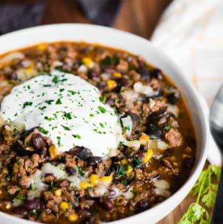 taco chili in bowl with sour cream