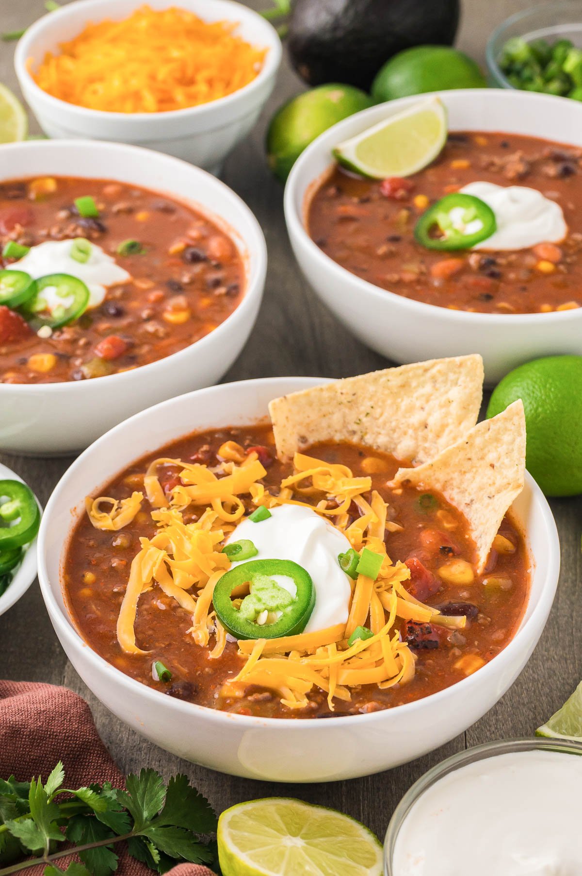 bowl of homemade taco soup with toppings.