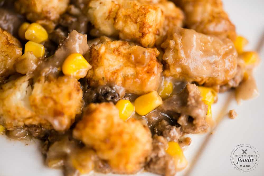 close up image of tater tot casserole with ground beef and corn