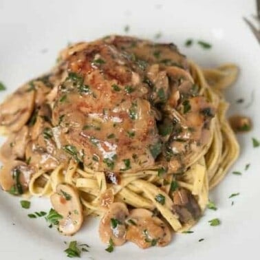 Ready in just 30 minutes, Tender Pork Marsala made with marinated pork tenderloin smothered in a mushroom wine sauce, is perfect for any night of the week.