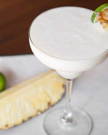 Shake up your traditional drink with this Tequila Pina Colada made with silver tequila, coconut cream, fresh pineapple, plus pineapple and lime juice.