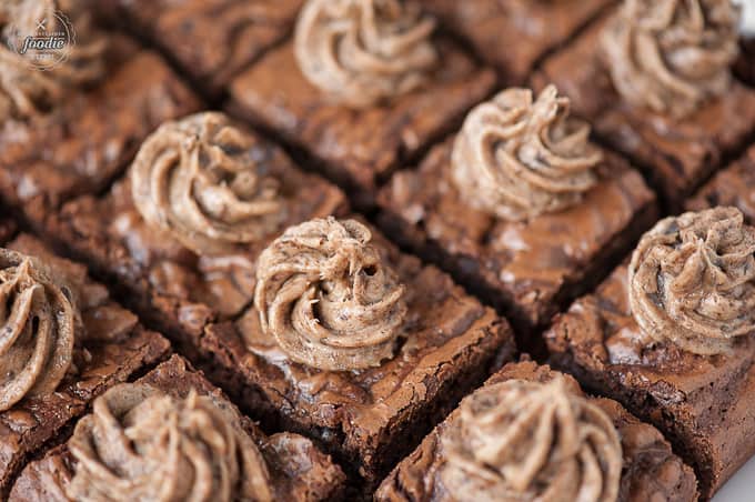 Cut squares of frosted brownies made with thin mint cookies