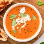 tomato soup from pasta sauce in white bowl with grilled cheese.
