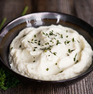 Two-Ingredient Cauliflower Mash is a quick, easy, healthy, low carb side dish that is so rich and delicious that you might actually mistake the flavorful cauliflower for creamy mashed potatoes!