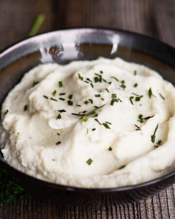 Two-Ingredient Cauliflower Mash is a quick, easy, healthy, low carb side dish that is so rich and delicious that you might actually mistake the flavorful cauliflower for creamy mashed potatoes!