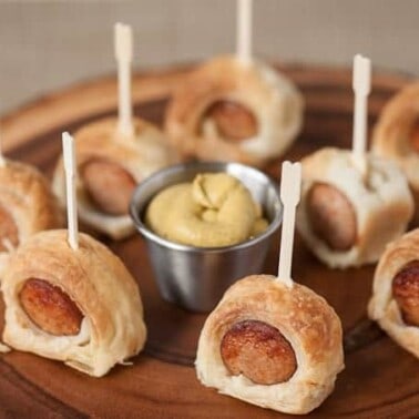 Taking just minutes to prepare, Two Ingredient Wrapped Kielbasa Bites, made with puff pastry, are the easiest and tastiest party appetizer you'll find.