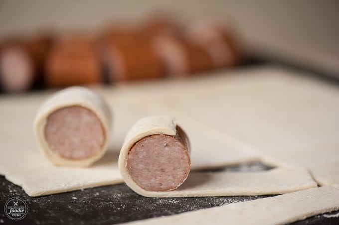 A close up of wrapped kielbasa bites, pre-cooked