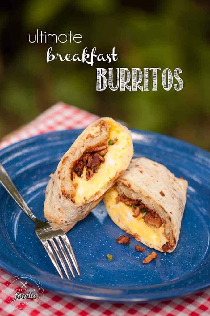 breakfast burrito cut in half on blue plate