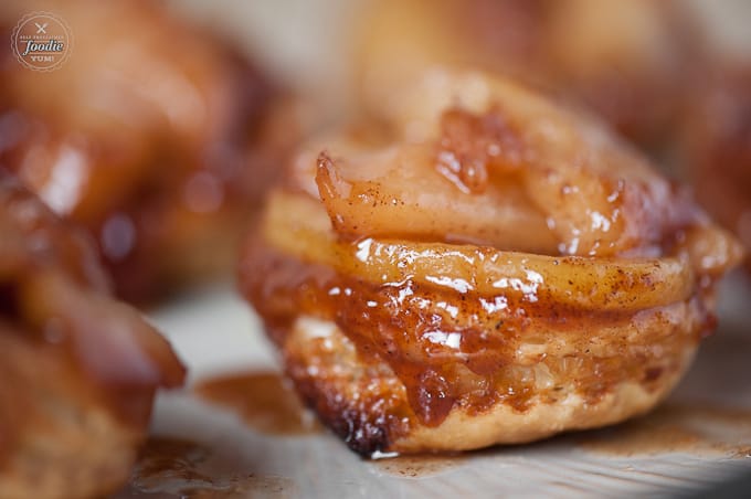 A close up of an upside down pear tart