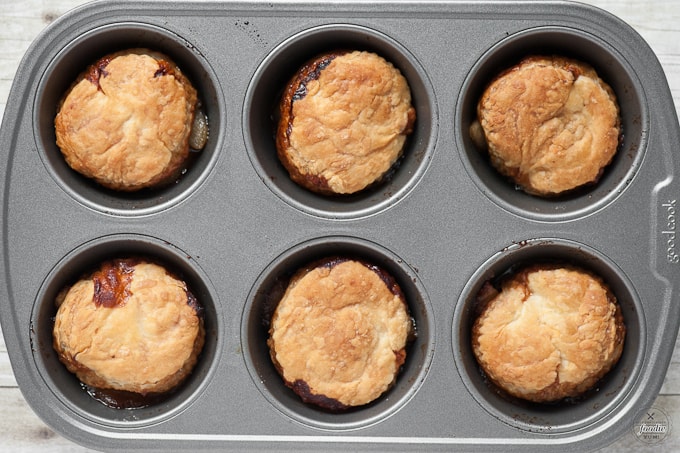 upside down pear tarts in a silver container