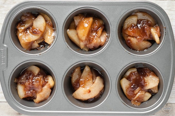 a container of cooked pears, with spices