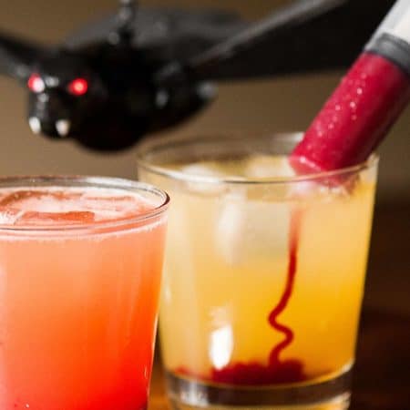 Vampire Cocktail is the perfect spooky Halloween drink. Syringes filled with sweetened raspberry puree look gory, but taste amazing!
